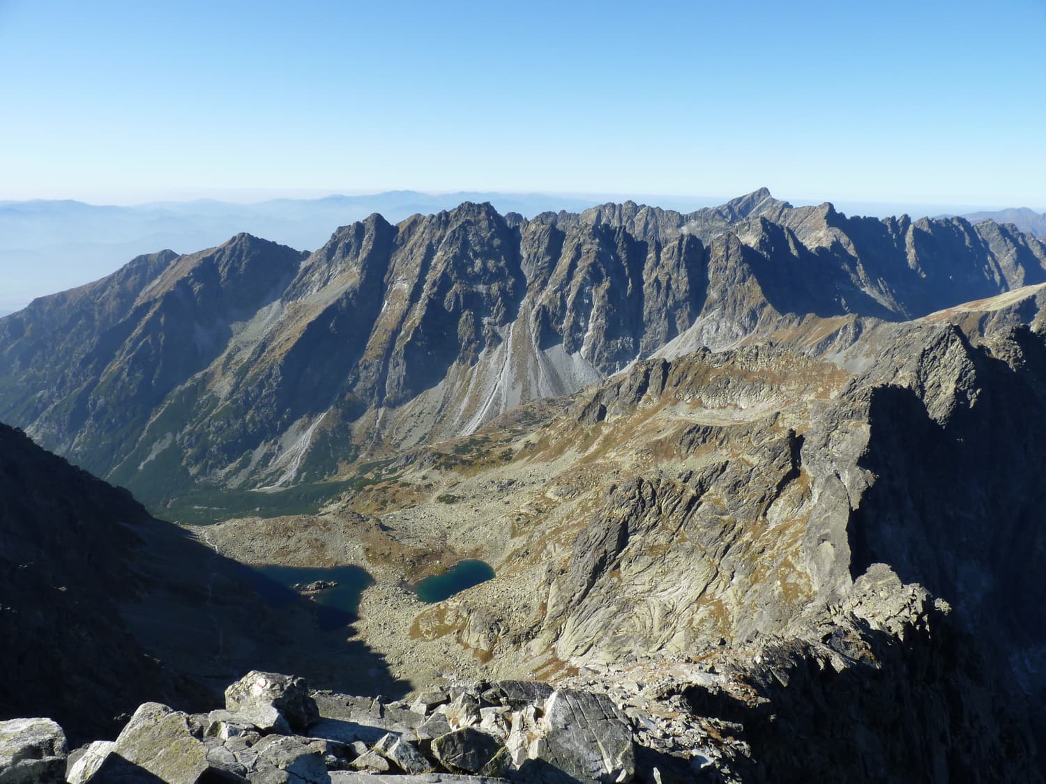 View from the summit of Rysy across jagged High Tatra ridges and valleys
